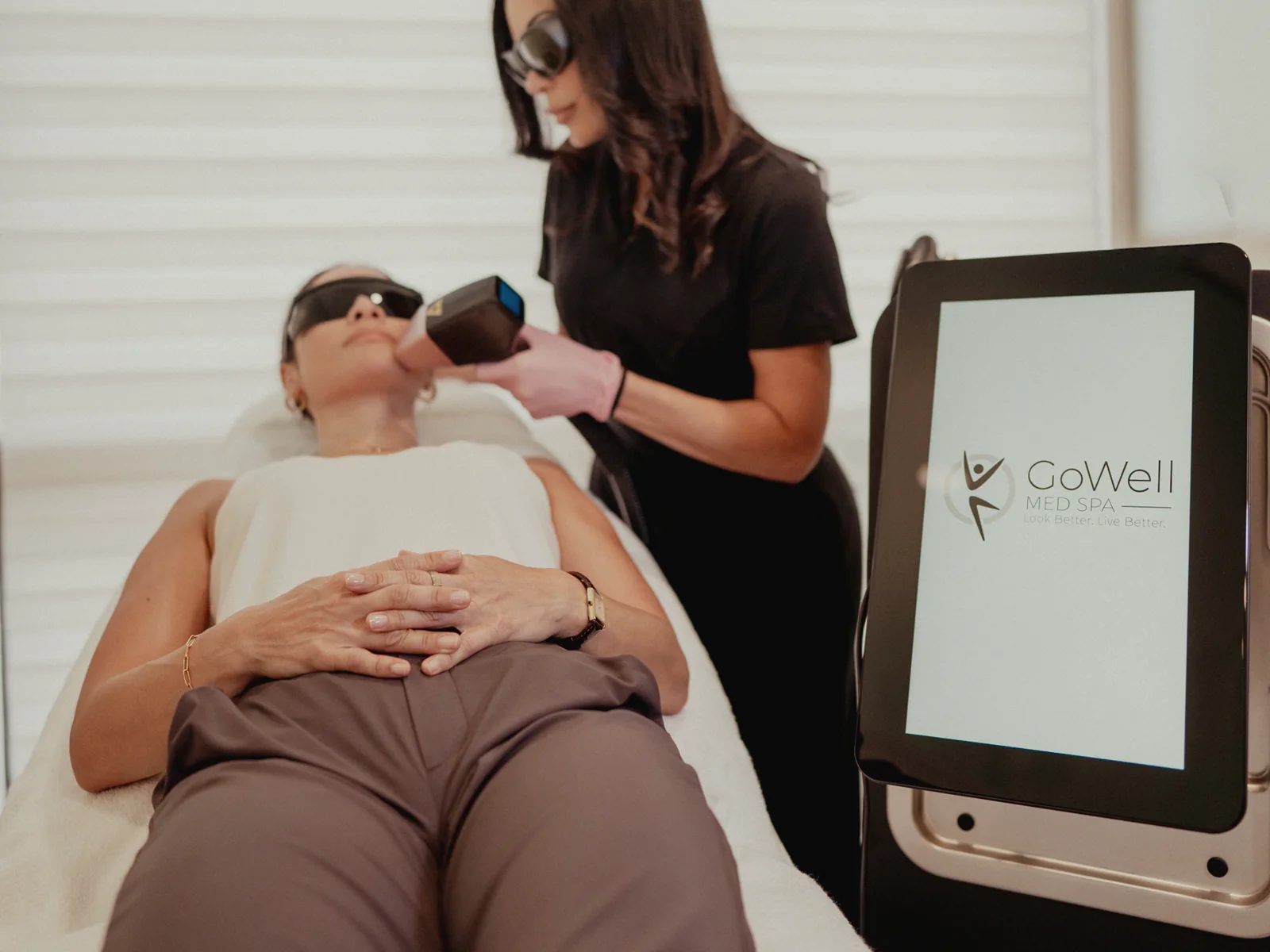 GoWell laser specialist treating a client with laser hair removal in Coral Springs
